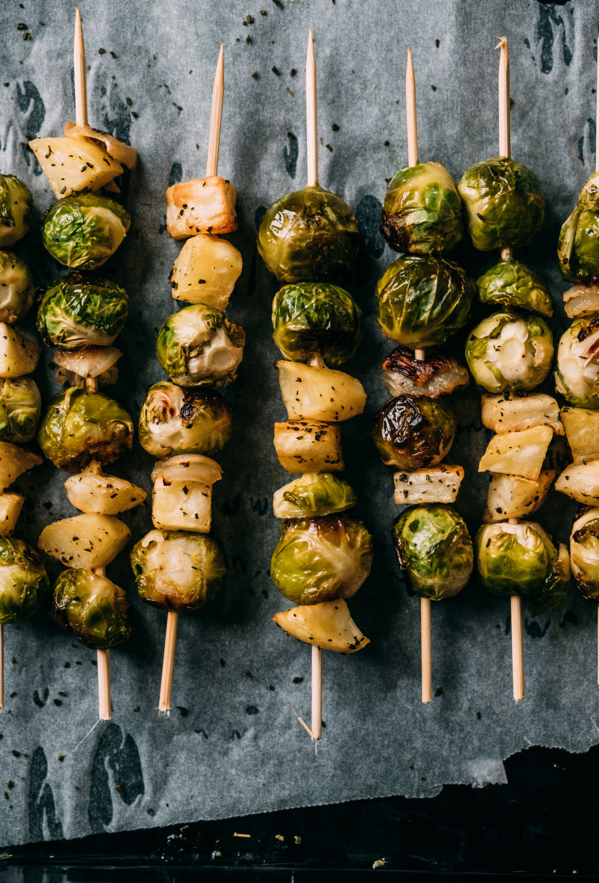 Brussels Sprouts Skewers with roasted potatoes and onion